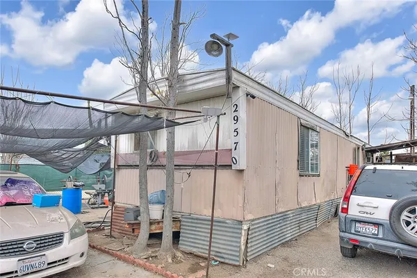 a kitchen with stainless steel appliances granite countertop a refrigerator and a stove