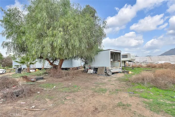 a view of a backyard of a house