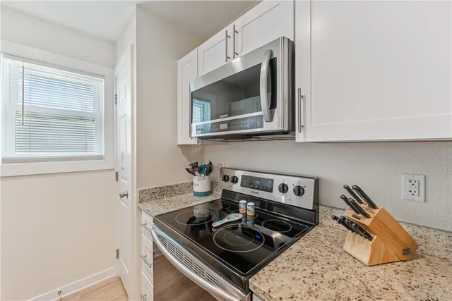 a kitchen with a stove and a microwave