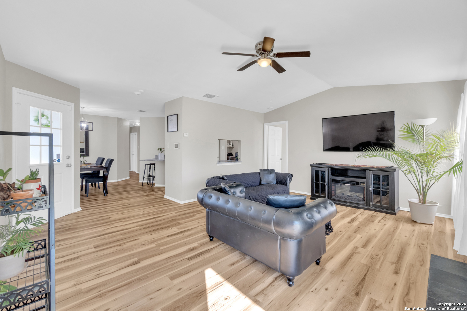 8722 Ridge Moon Drive San Antonio, TX 78239 - Photo 3 of 19 a living room with furniture and a fireplace