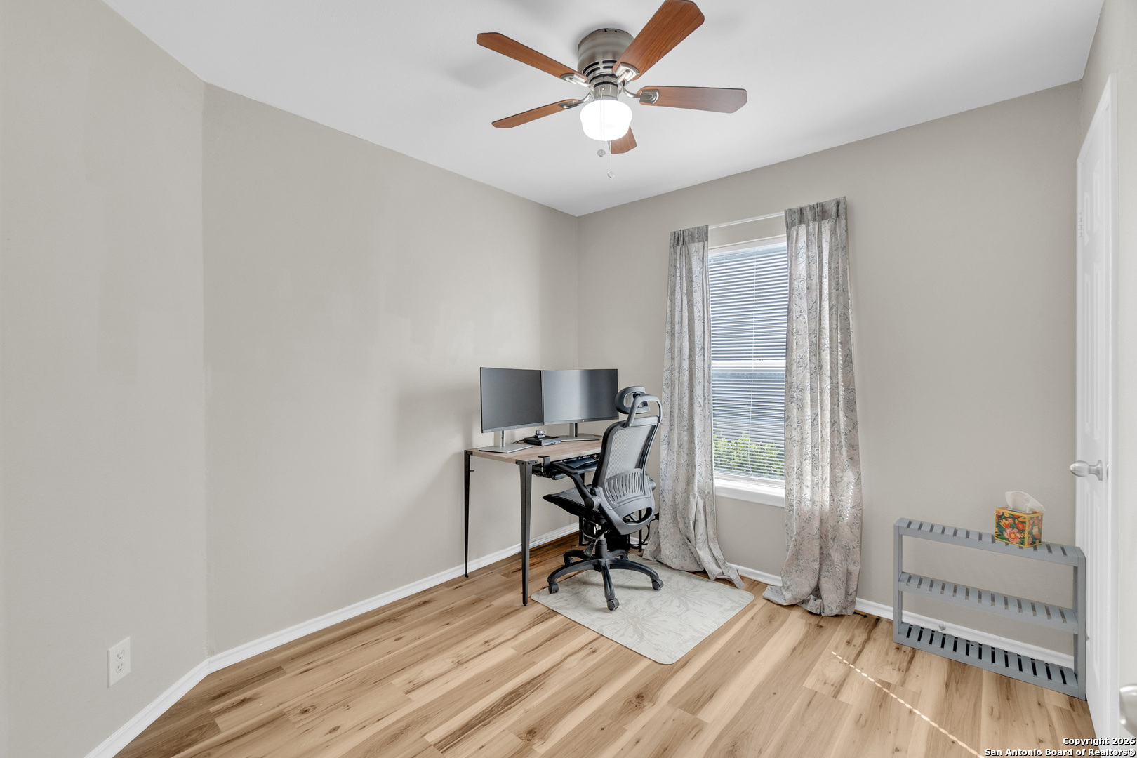 8722 Ridge Moon Drive San Antonio, TX 78239 - Photo 8 of 19 a workspace with wooden floor and a window