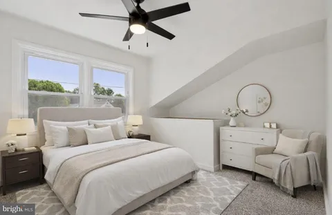 a bedroom with bed and window