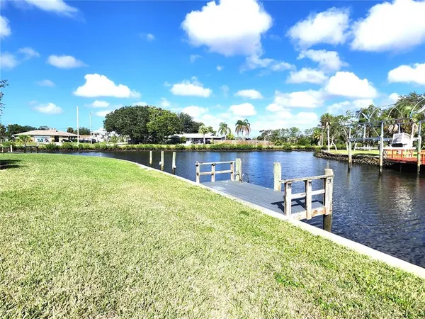 a view of a lake with sitting area