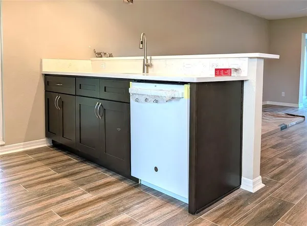 a utility room with cabinets