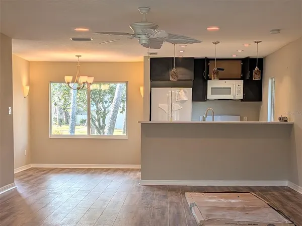 a view of kitchen with furniture and window