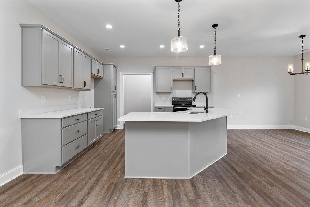 Tba Lindburgh Drive Waynesboro, VA 22980 - Photo 11 of 42 a kitchen with kitchen island white cabinets stainless steel appliances a sink and wooden floor