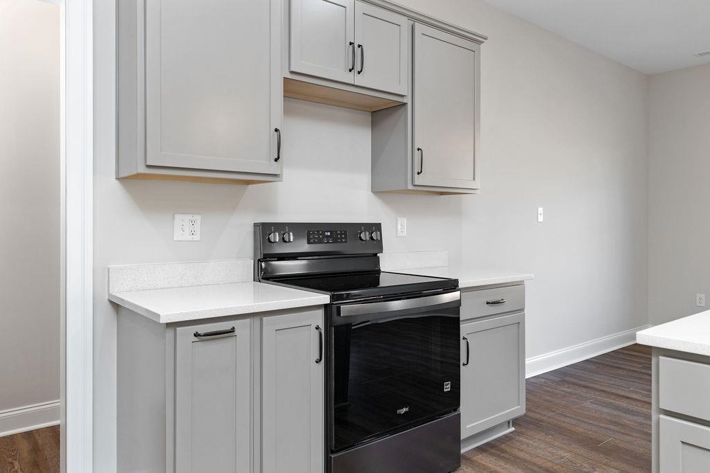 Tba Lindburgh Drive Waynesboro, VA 22980 - Photo 13 of 42 a kitchen with stainless steel appliances granite countertop a stove a microwave and a white cabinets