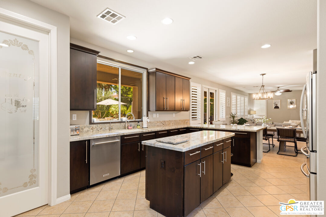 80592 Apricot Lane Indio, CA 92201 - Photo 13 of 45 a kitchen with a sink stove and cabinets