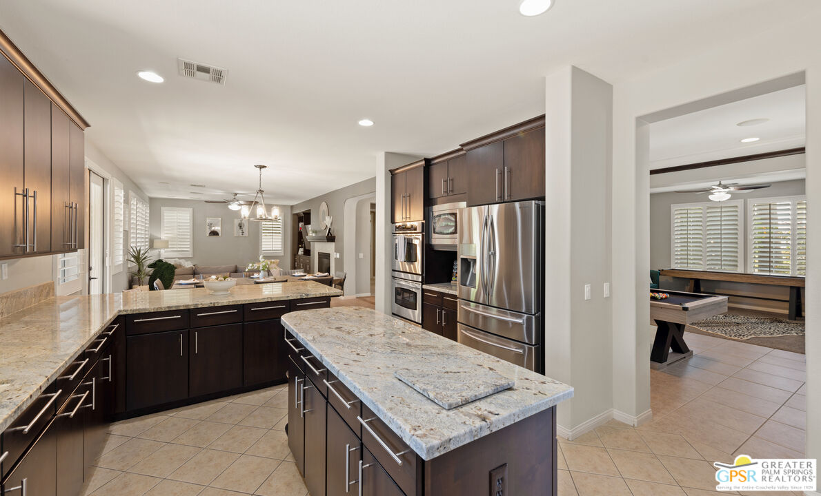 80592 Apricot Lane Indio, CA 92201 - Photo 14 of 45 a kitchen with granite countertop stainless steel appliances and sink