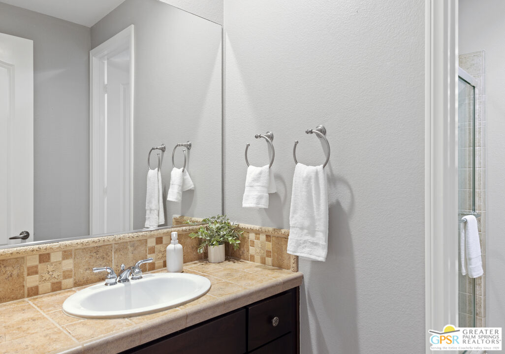 80592 Apricot Lane Indio, CA 92201 - Photo 21 of 45 a bathroom with a sink and a mirror