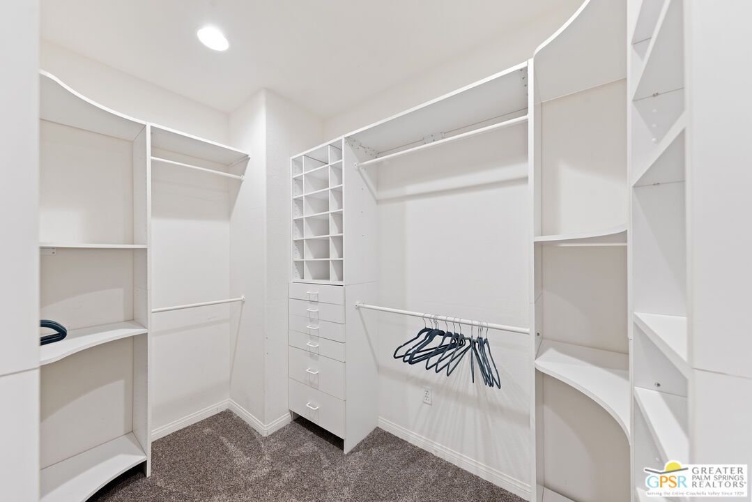 80592 Apricot Lane Indio, CA 92201 - Photo 28 of 45 a view of walk in closet with empty racks
