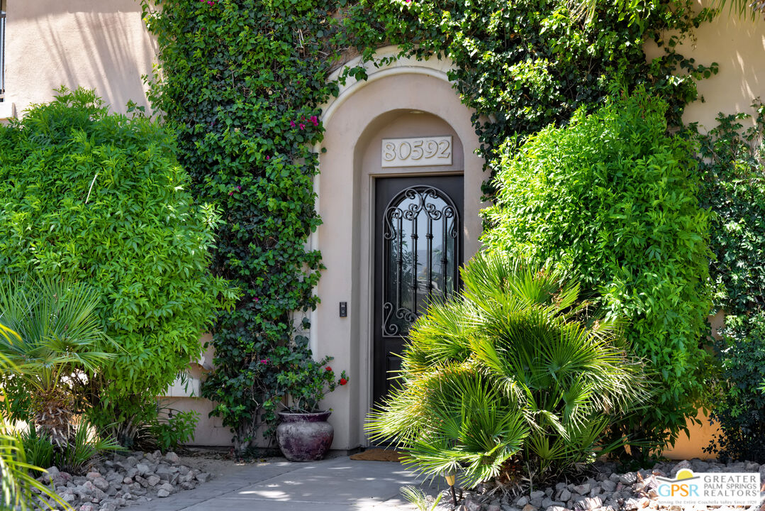 80592 Apricot Lane Indio, CA 92201 - Photo 3 of 45 a front view of a house with a garden