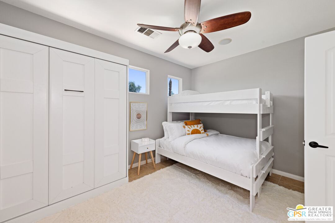 80592 Apricot Lane Indio, CA 92201 - Photo 34 of 45 a bedroom with a bed and a ceiling fan