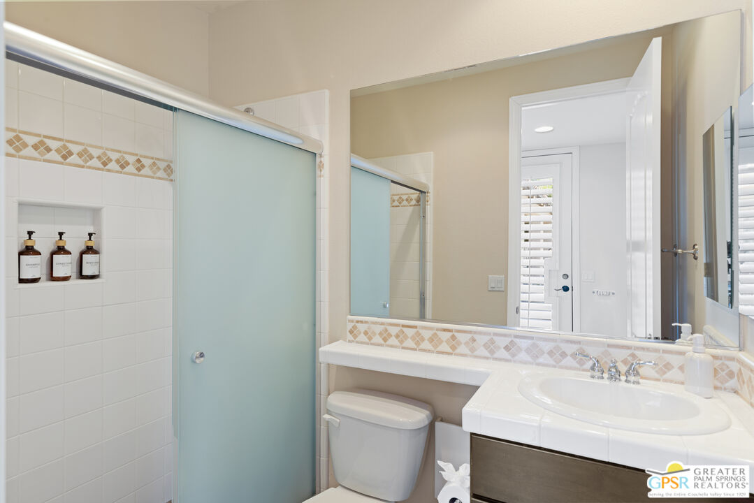 80592 Apricot Lane Indio, CA 92201 - Photo 36 of 45 a bathroom with a sink a toilet and mirror