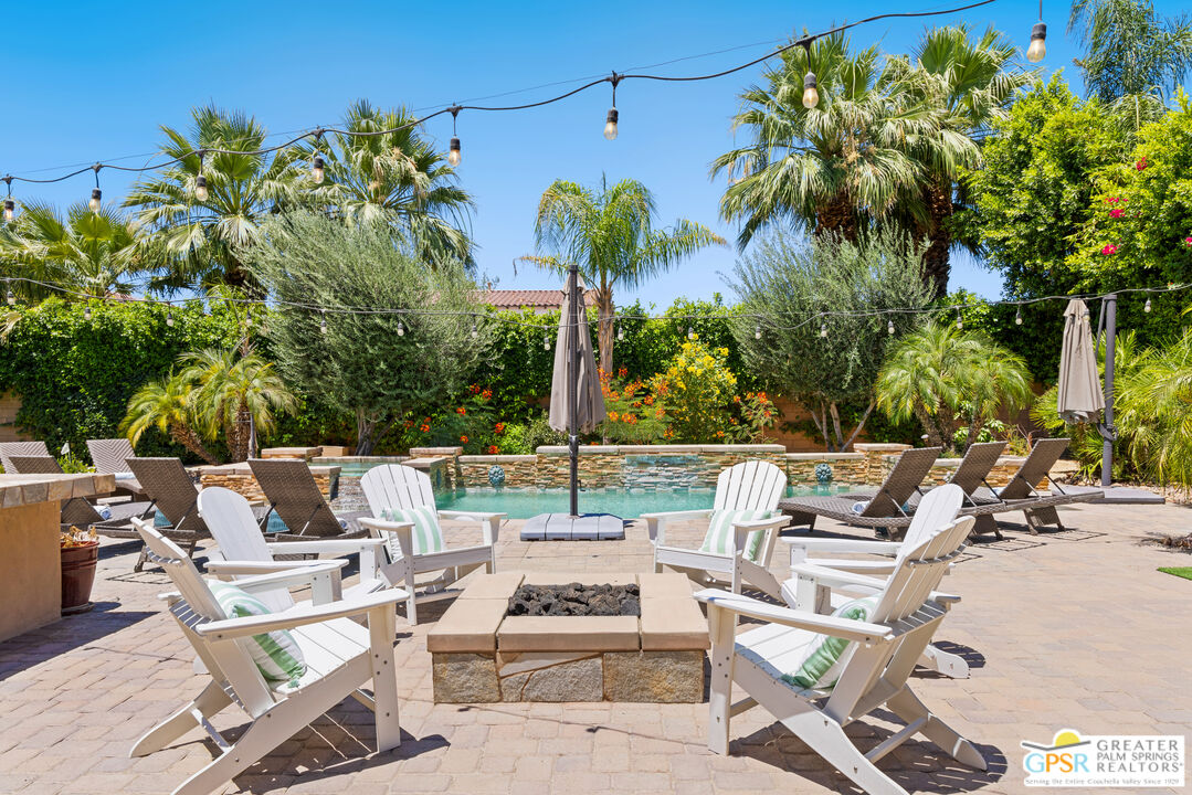 80592 Apricot Lane Indio, CA 92201 - Photo 37 of 45 a view of a patio with chairs and a potted plant