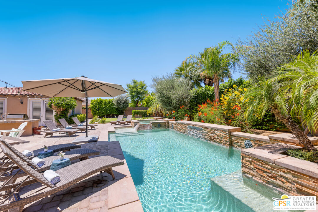 80592 Apricot Lane Indio, CA 92201 - Photo 40 of 45 a view of a swimming pool with lounge chairs in patio