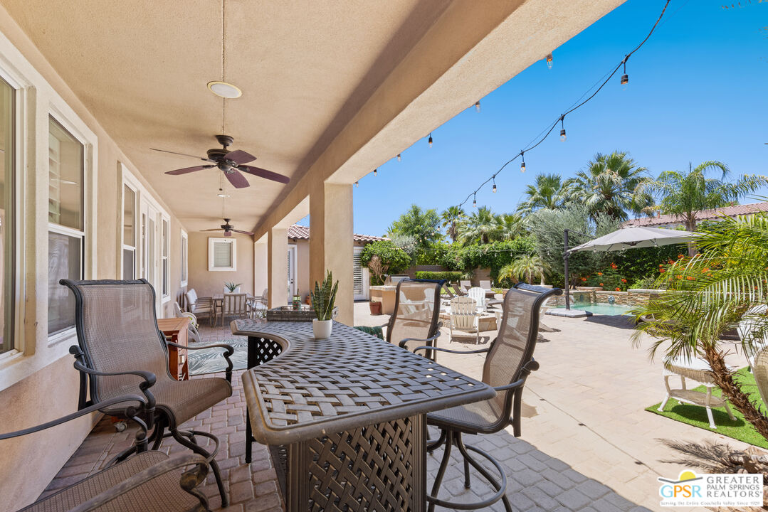 80592 Apricot Lane Indio, CA 92201 - Photo 42 of 45 a view of a patio with table and chairs and potted plants