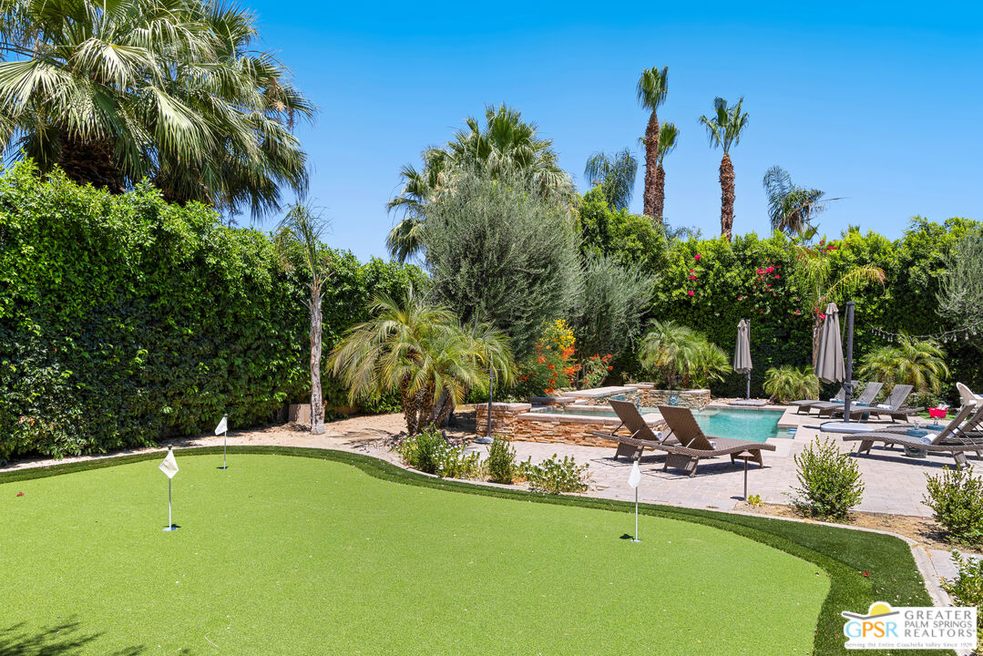 80592 Apricot Lane Indio, CA 92201 - Photo 44 of 45 a view of a swimming pool with lawn chairs under an umbrella