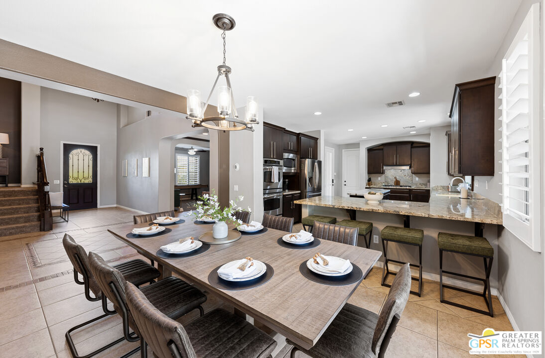 80592 Apricot Lane Indio, CA 92201 - Photo 7 of 45 a view of a dining room and kitchen with a table chairs