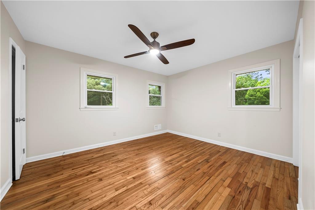 23 East Camelia Road Northeast Rome, GA 30161 - Photo 19 of 27 a view of empty room with wooden floor and fan
