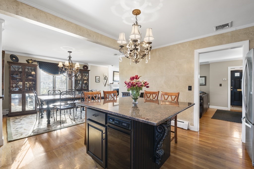 5 Colgate Road Marblehead, MA 01945 - Photo 13 of 36 a view of a dining table chairs and chandelier