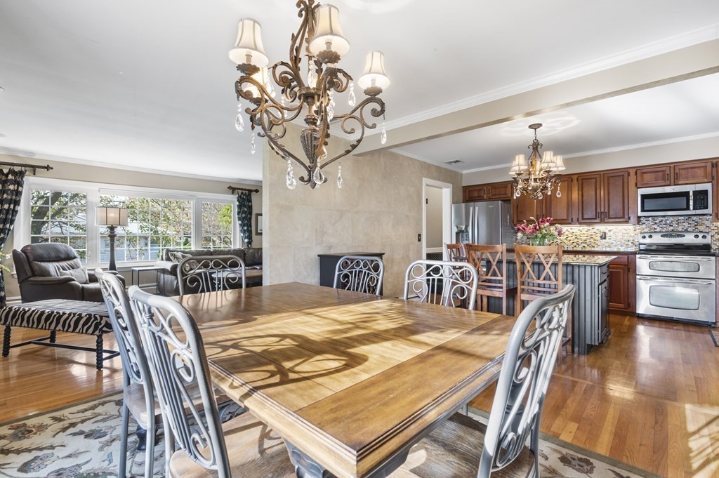 5 Colgate Road Marblehead, MA 01945 - Photo 14 of 36 a view of a dining room with furniture a chandelier and wooden floor
