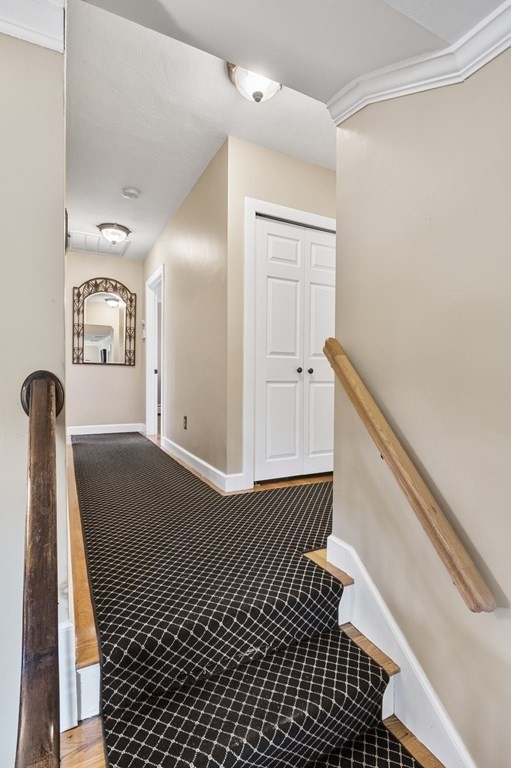 5 Colgate Road Marblehead, MA 01945 - Photo 20 of 36 a view of a hallway with wooden floor and staircase