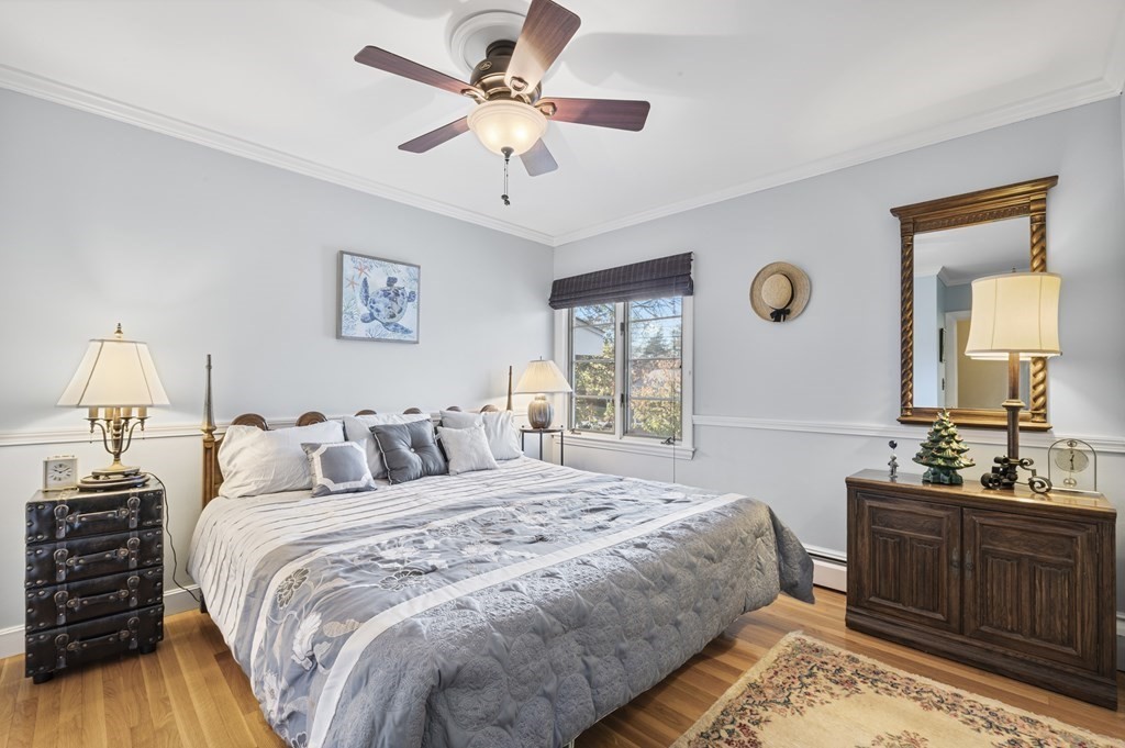5 Colgate Road Marblehead, MA 01945 - Photo 21 of 36 a bedroom with a bed and a chandelier