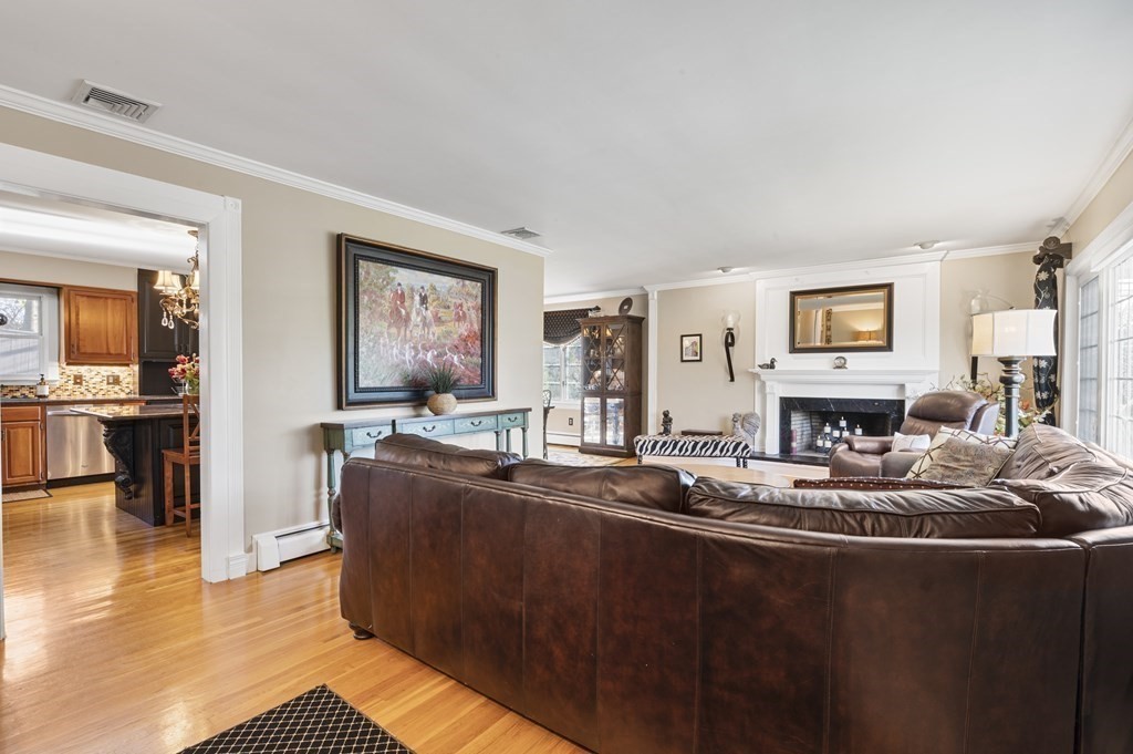 5 Colgate Road Marblehead, MA 01945 - Photo 9 of 36 a living room with fireplace furniture and a flat screen tv