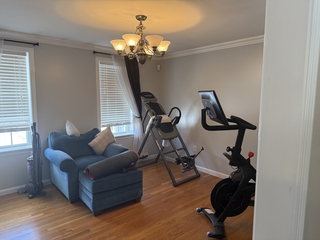 11 Trout Farm Way Wareham, MA 02576 - Photo 11 of 24 a living room with furniture and a chandelier