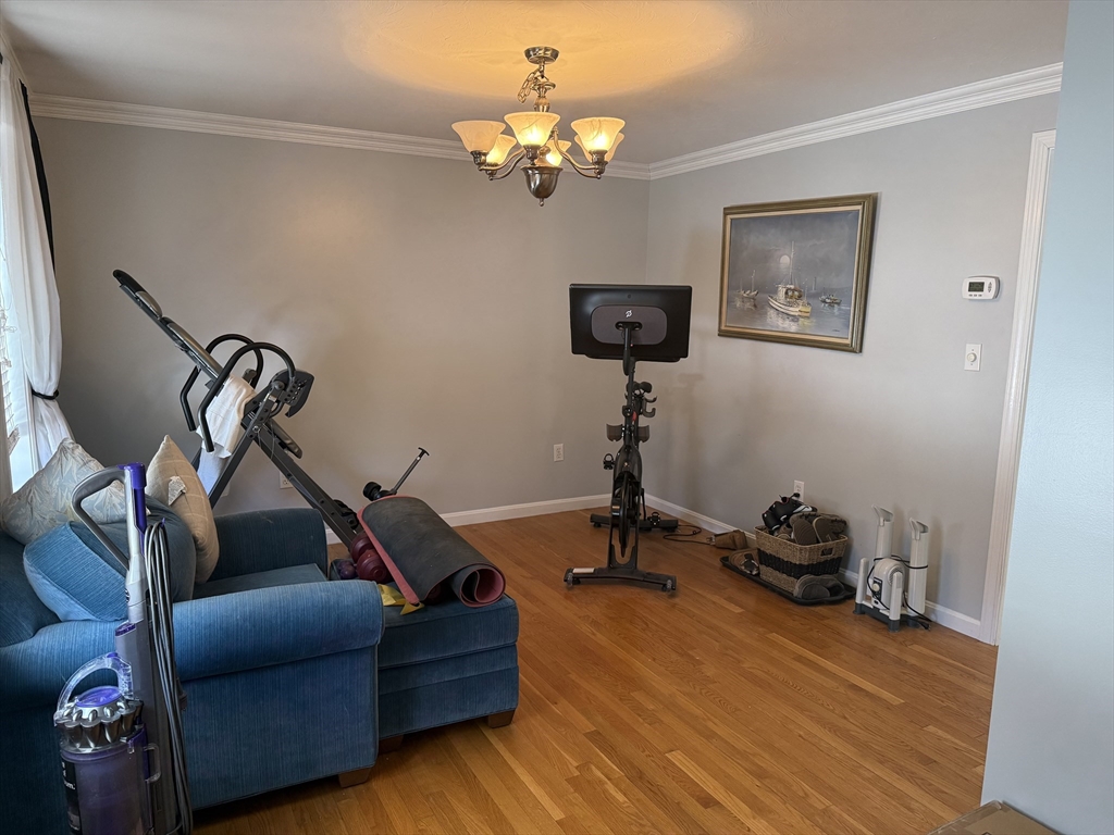 11 Trout Farm Way Wareham, MA 02576 - Photo 12 of 24 a living room with furniture a chandelier and a window