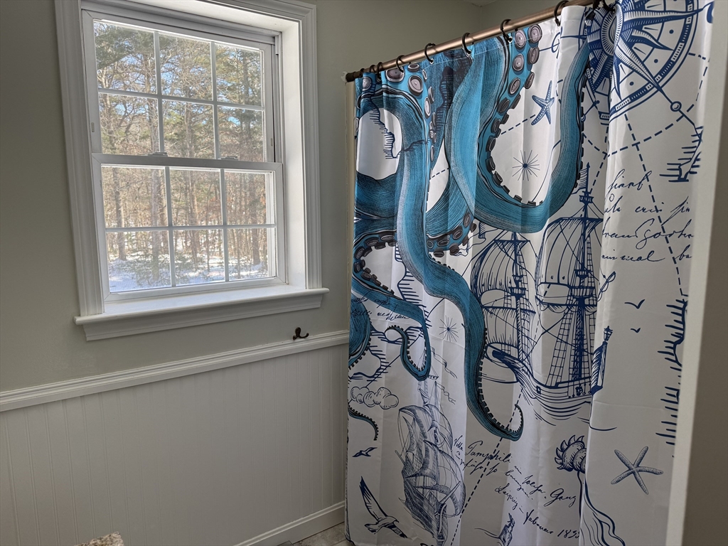 11 Trout Farm Way Wareham, MA 02576 - Photo 16 of 24 a bathroom with a large window and a shower