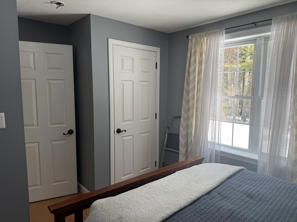 11 Trout Farm Way Wareham, MA 02576 - Photo 19 of 24 a bedroom with a bed and a window