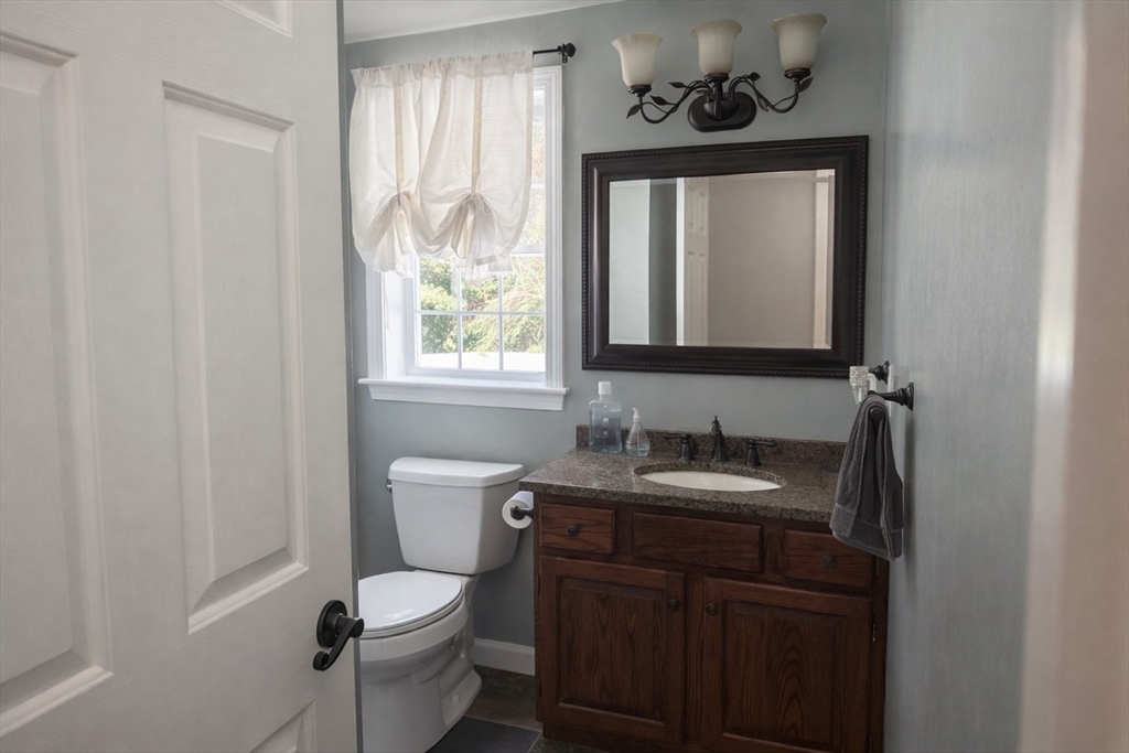 11 Trout Farm Way Wareham, MA 02576 - Photo 9 of 24 a bathroom with a toilet sink and mirror