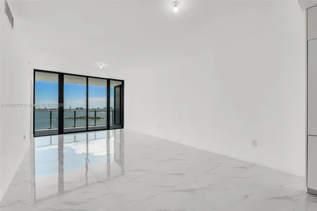 a kitchen with cabinets and white stainless steel appliances