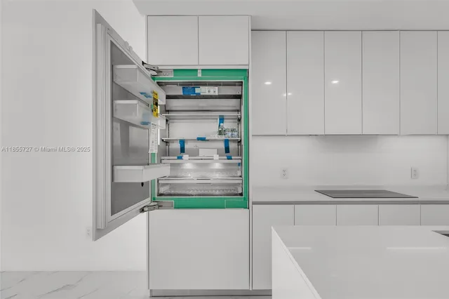 a bathroom with a tub and glass door