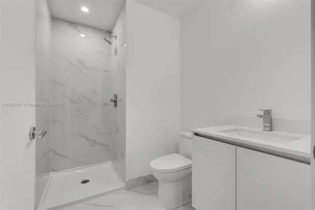 a view of street with tall trees