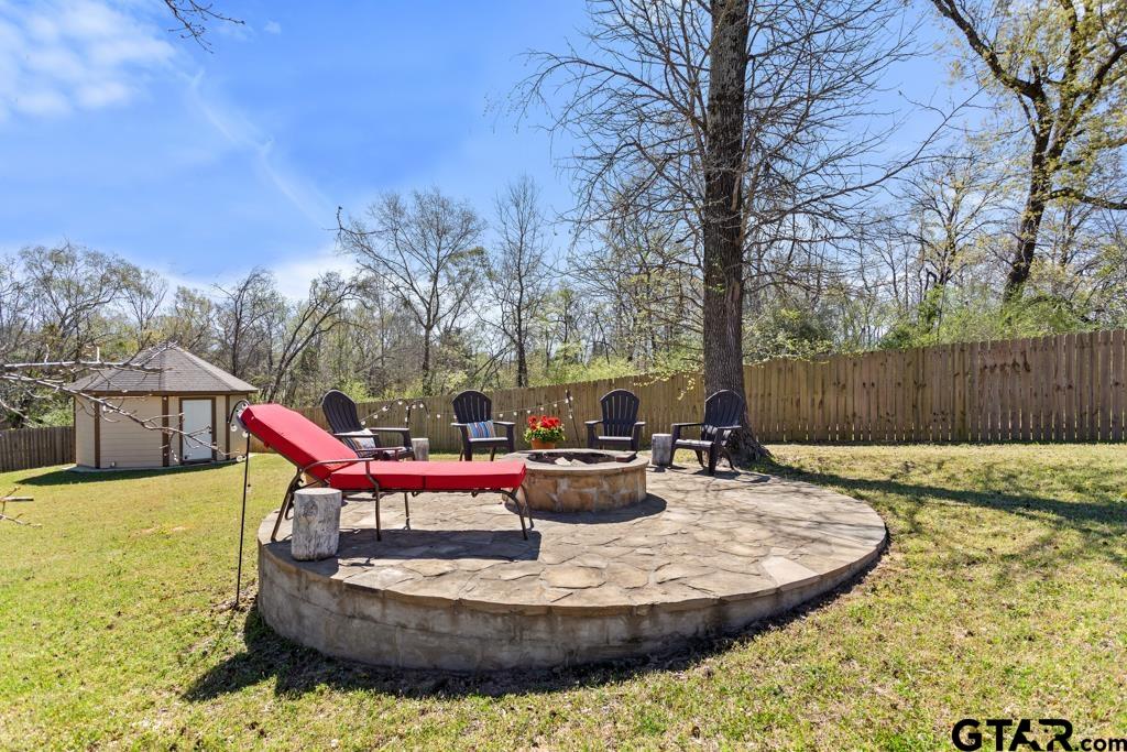 706 Duke Place Tyler, TX 75704 - Photo 26 of 33 a swimming pool with outdoor seating