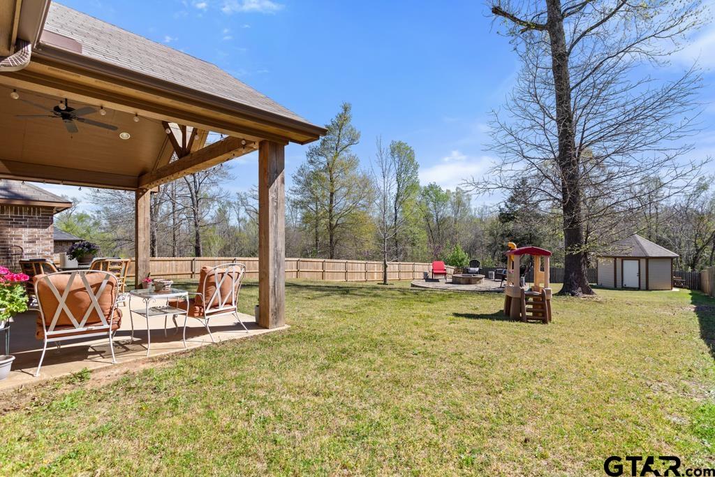 706 Duke Place Tyler, TX 75704 - Photo 28 of 33 a view of swimming pool with chairs and tables in patio
