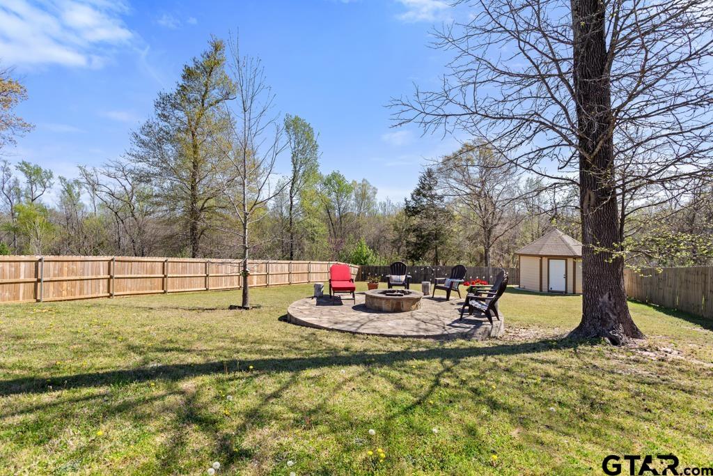 706 Duke Place Tyler, TX 75704 - Photo 29 of 33 a view of back yard with swimming pool