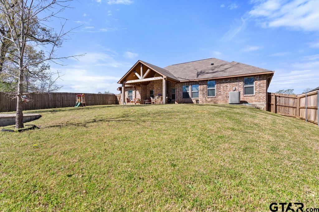 706 Duke Place Tyler, TX 75704 - Photo 30 of 33 a big house with large trees in front of it
