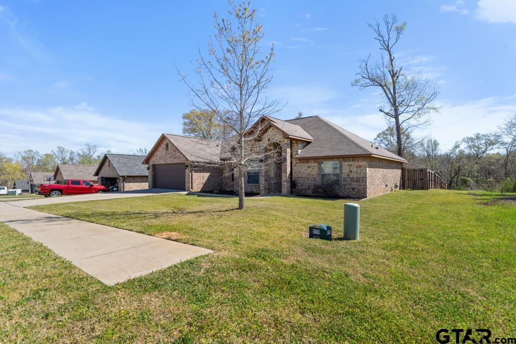 706 Duke Place Tyler, TX 75704 - Photo 33 of 33 a front view of house with yard and garage