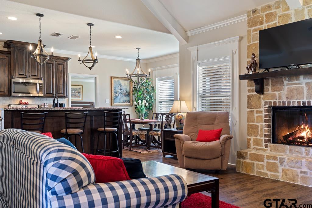 706 Duke Place Tyler, TX 75704 - Photo 5 of 33 a living room with furniture flat screen tv and a fireplace