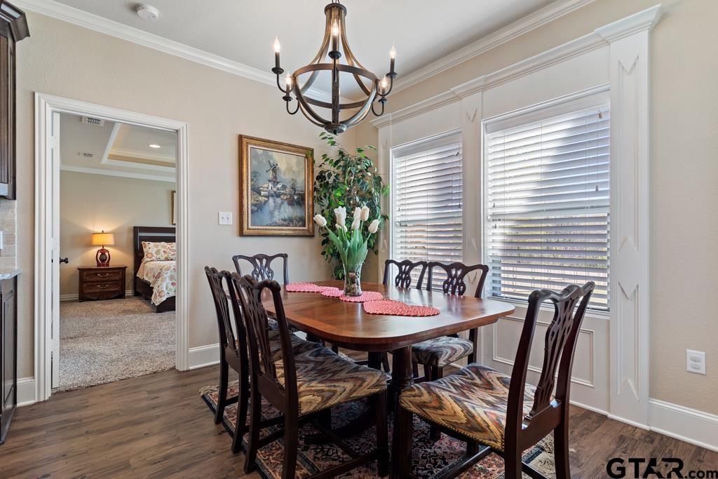 706 Duke Place Tyler, TX 75704 - Photo 6 of 33 a view of a dining room with furniture window and wooden floor