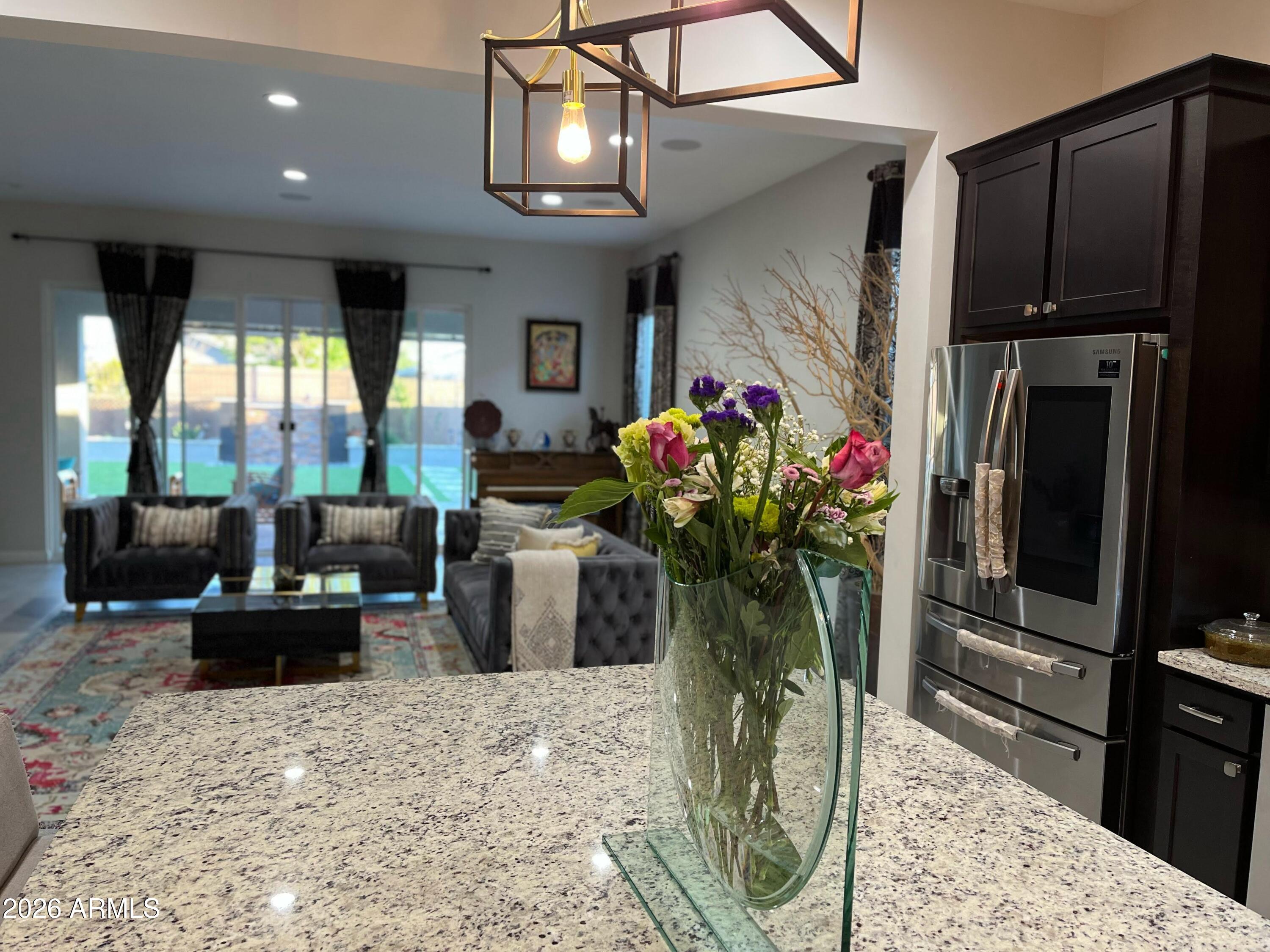 2141 East Alameda Road Phoenix, AZ 85024 - Photo 12 of 15 a bunch of flowers in front of a livingroom