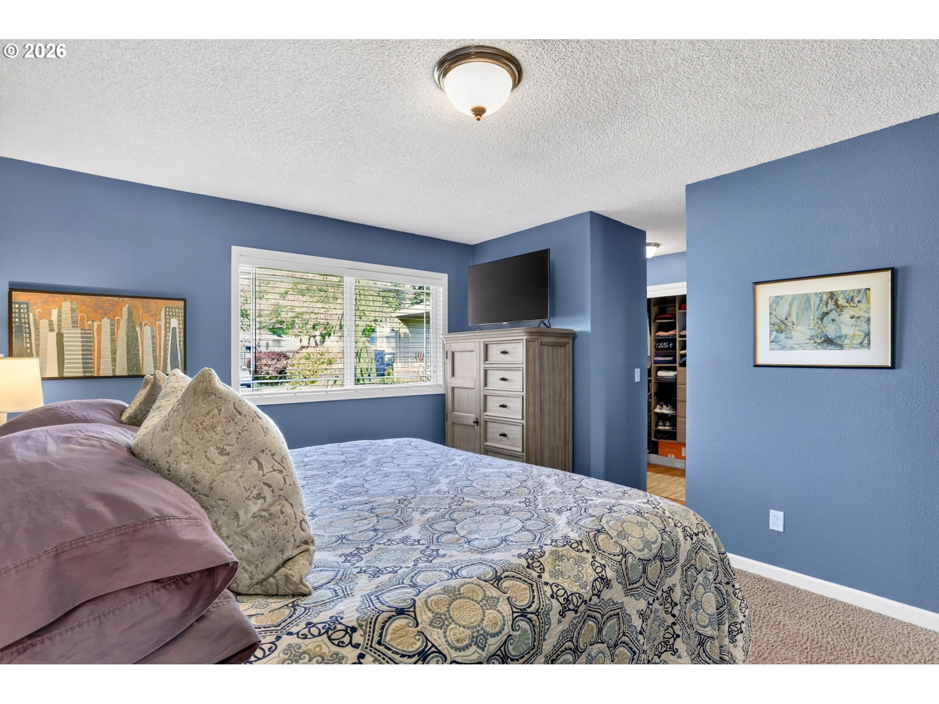 1776 Southeast 114th Place Portland, OR 97216 - Photo 31 of 47 a bedroom with a large bed and a window