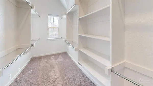 a view of an empty walk in closet