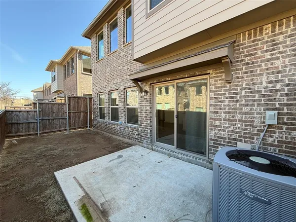 a view of a brick house with many windows
