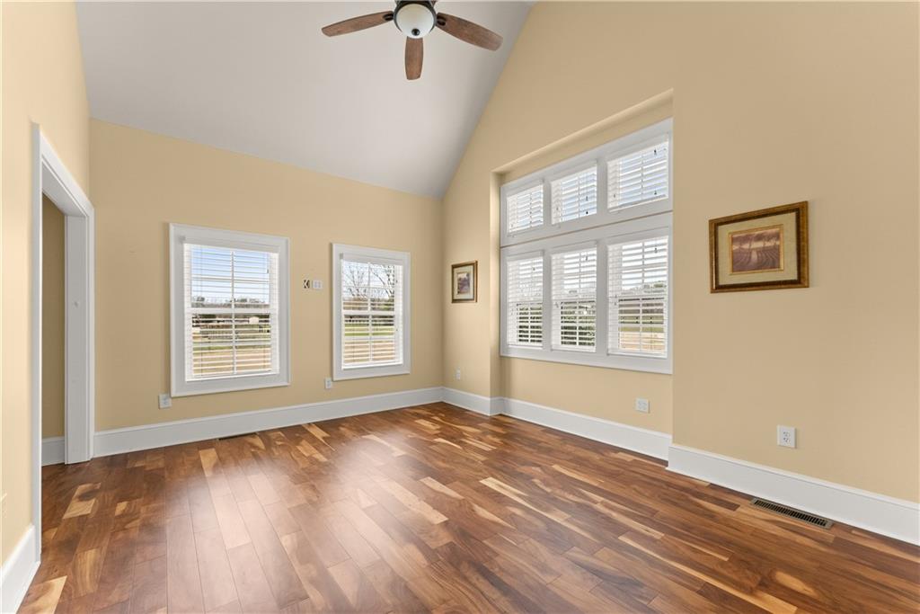 725 County Farm Road Jefferson, GA 30549 - Photo 7 of 66 a view of an empty room with wooden floor and a window