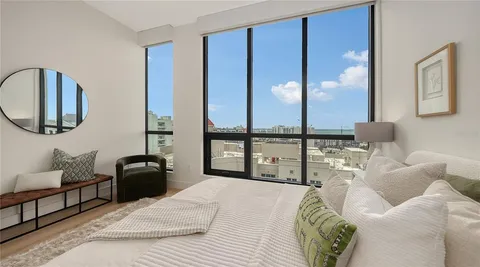 a bathroom with double vanity sinks and a mirror